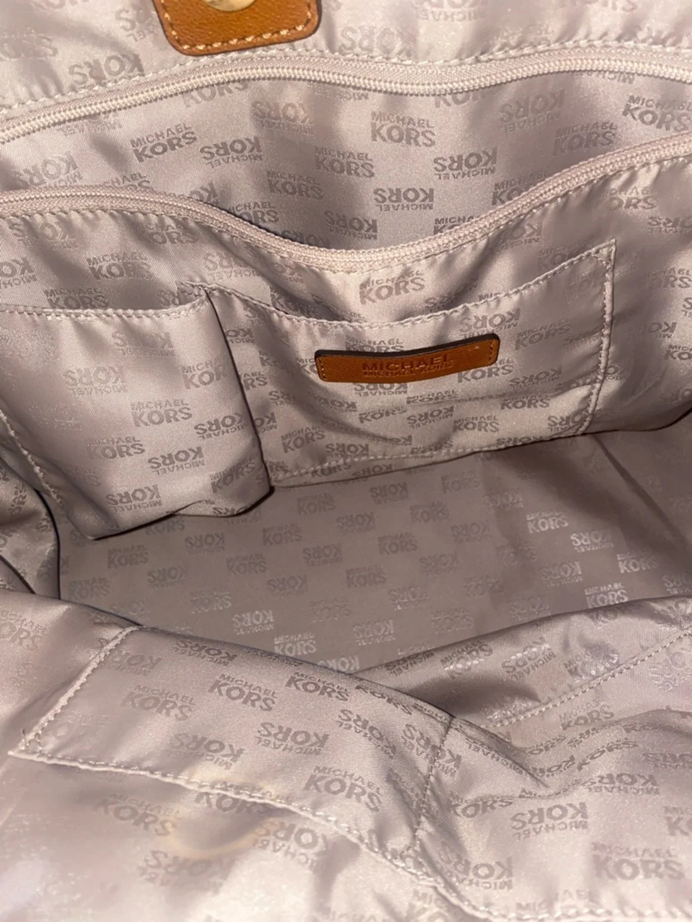 Michael Kors Raffia Tote with Tan Leather Trim and handles.